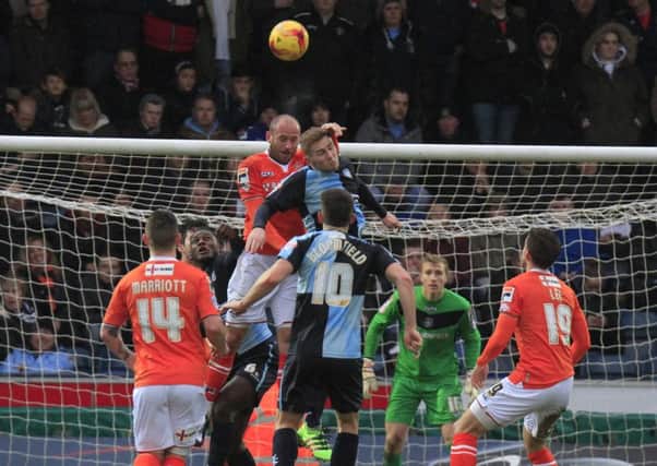 Scott Cuthbert clears the danger at Wycombe