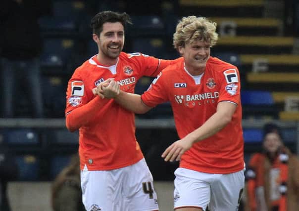 Cameron McGeehan celebrates his winner against Wycombe