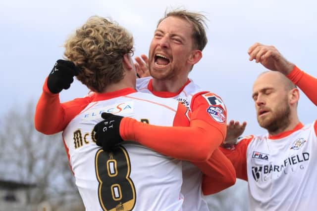 Danny Green celebrates Luton's first goal at Bootham Crescent since 2001