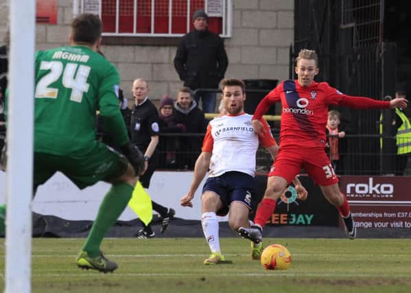 Stephen O'Donnell crosses for Luton's second goal at York