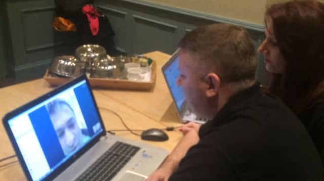 Paul Golding and Jayda Fransen speak to a Beds Police officer via Skype during the demonstration