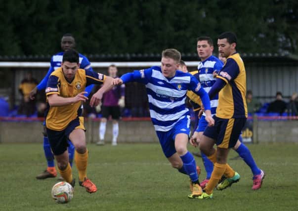 Adam Watkins tries to win possession at Slough