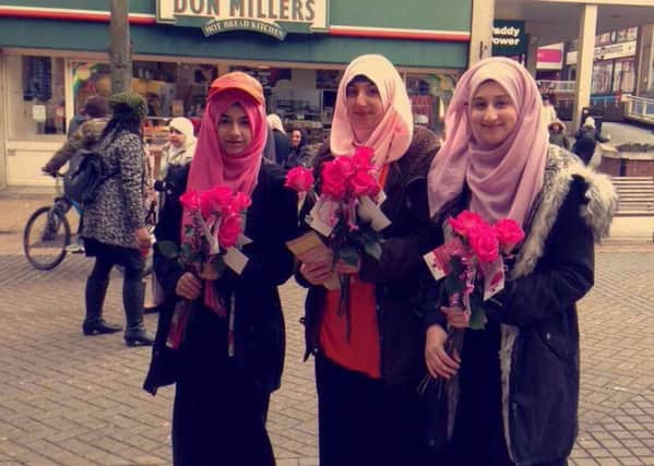The volunteers handed out roses to ladies in Luton. Photo by Yasmin Stannard