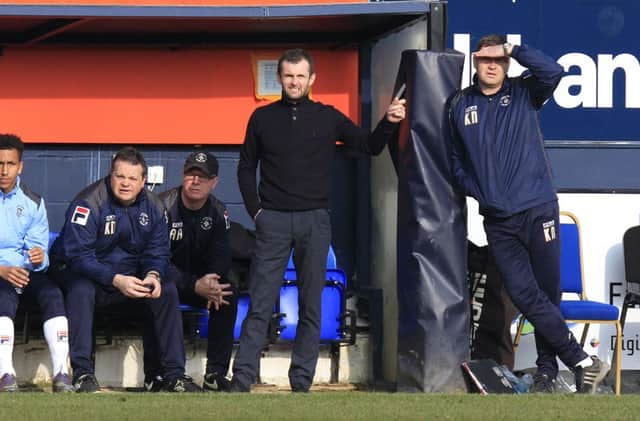 Nathan Jones watches his side lose at home to Crawley