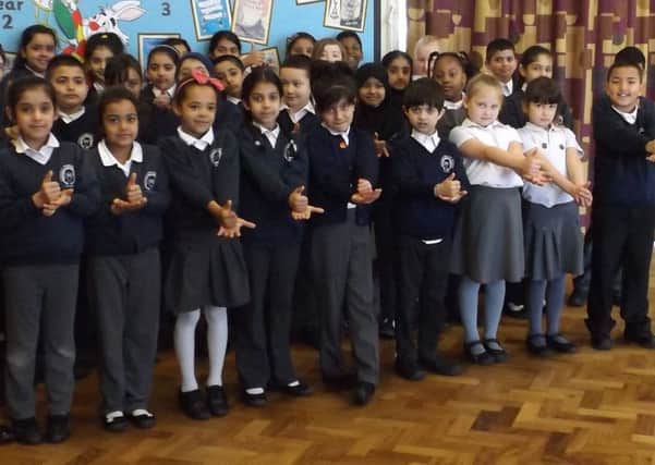 Little learners at Icknield Primary in Luton learn to sign and sing for vulnerable deaf children