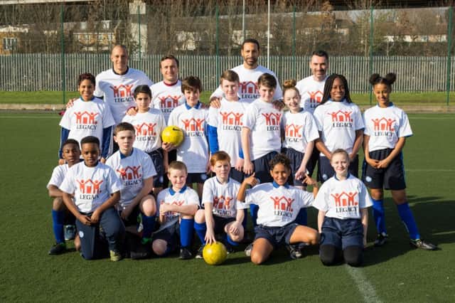 Rio Ferdinand, business partners Mark Noble and Bobby Zamora, with children