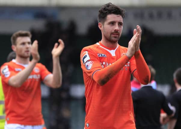 Alan Sheehan and Stephen O'Donnell applaud Town's travelling fans at Plymouth