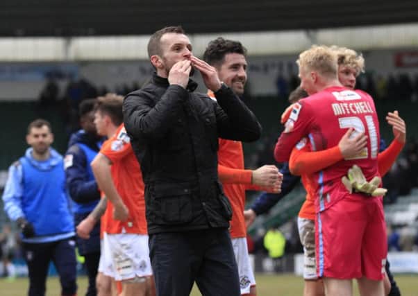 Hatters boss Nathan Jones celebrates at Home Park on Saturday