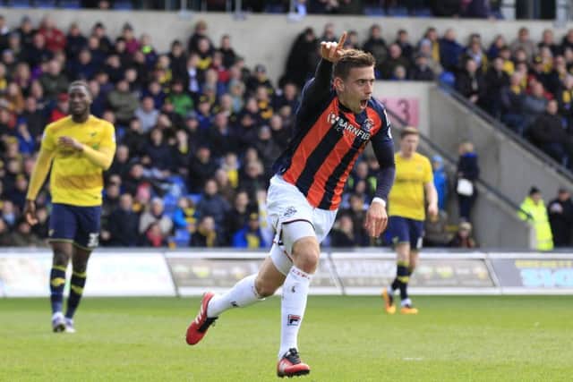 Olly Lee wheels away after making it 2-1 to Luton