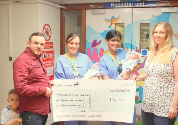 Kelly and Michael Mapp presenting the cheque to the NICU unit at the Luton and Dunstable hospital