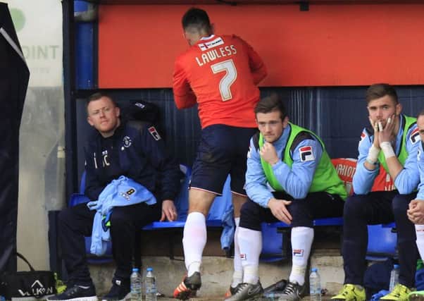 Alex Lawless lets his frustration out on the dug out after being substituted