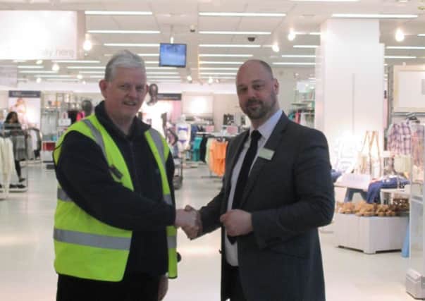 M&S retiree Jim Bell with Mall store manager Darren Collinson