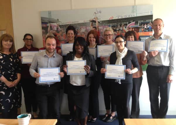 Pictons staff with their dementia friends certificates