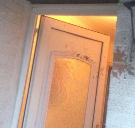 The doorway of the home was also targeted