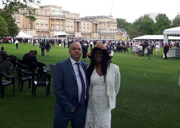 Debra Knight and Gordon Davis of social enterprise Nine Red Presents at a Buckingham Palace garden party