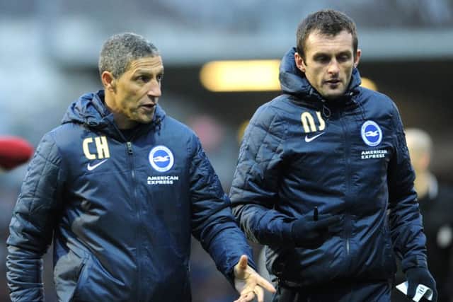 Nathan Jones with Brighton manager Chris Hughton