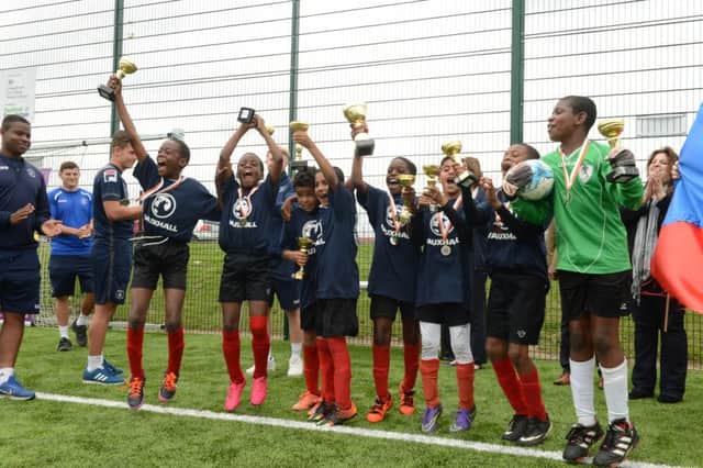Hillsborough School celebrate after winning Luton's mini European Football Championships