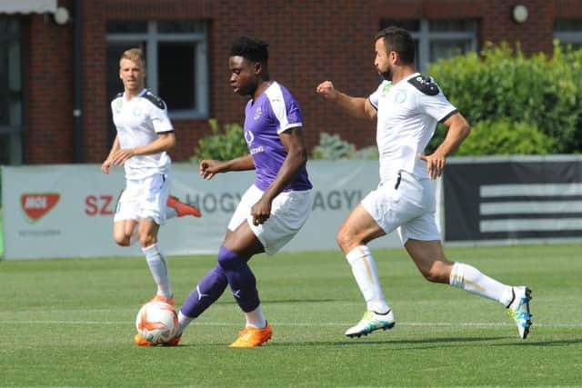 Pelly Ruddock Mpanzu in action for Town out in Hungary