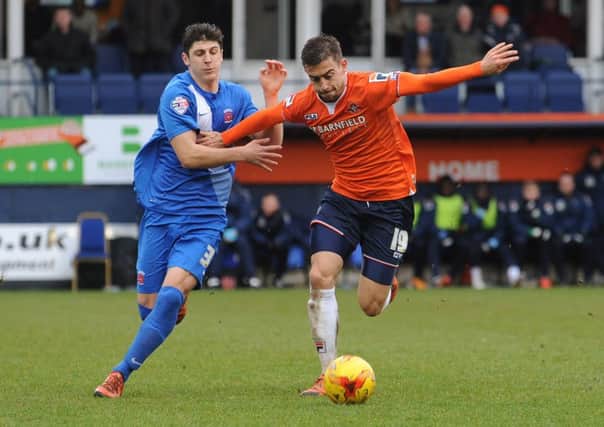 Jake Gray challenges Olly Lee when playing for Hartlepool at Kenilworth Road last season