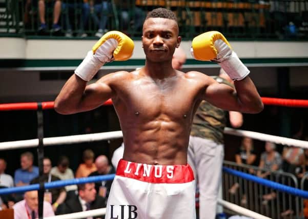 Linus Udofia celebrates his second pro victory - pic: Natalie Mayhew - Butterfly Boxing