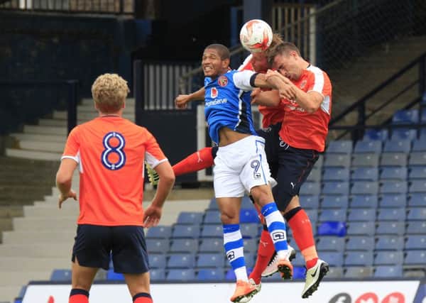 Hatters' defence challenge match-winner Simeon Jackson for an aerial ball