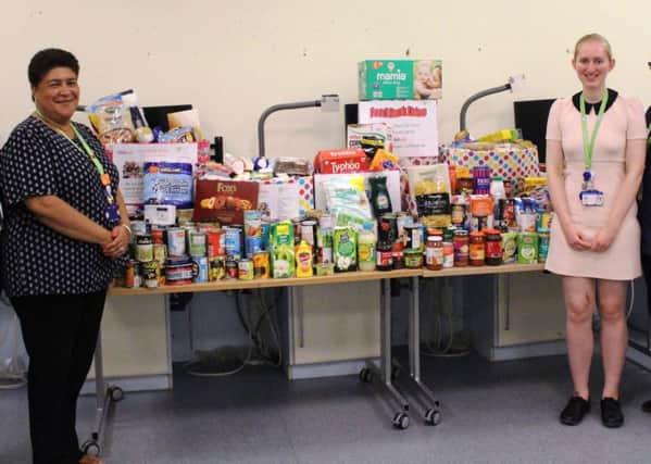Toni Marie Doherty (left) with colleagues and some of the donations received