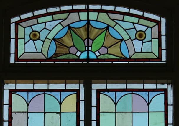 The glorious stained glass windows at Sandy Baptist Church after their repair by a local craftsman