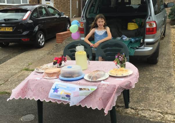 Nine-year-old Chloe Meadows of Wing you  raised more than Â£100 for Macmillan with a home-made leonade and cake sale