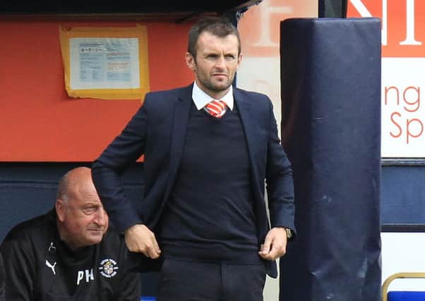 Hatters boss Nathan Jones watches on against Yeovil