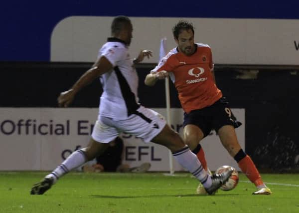 Jamie Turley is about to bring down Danny Hylton for Town's first penalty on Tuesday night