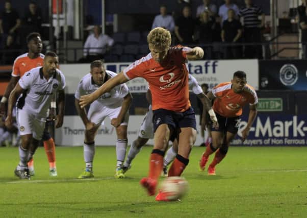 Cameron McGeehan scores the winning penalty against Newport