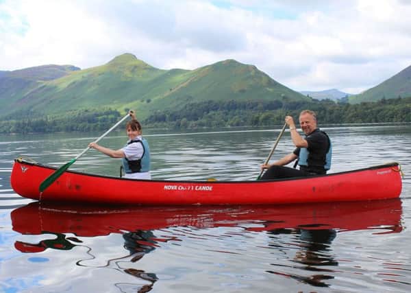 Chris and Carole Wiltshire enjoy a canoe ride on Derwentwater as part of a half-day session with the Keswick Canoe and Bushcraft company.