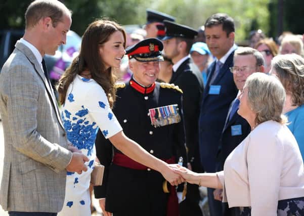 TRH The Duke and Duchess of Cambridge are greeted by the CEO of Keech Hospice Care. Photo by Danny Loo