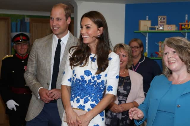 TRH The Duke and Duchess of Cambridge are shown into the Children's Day Support room of Keech Hospice Care. Photo by Danny Loo