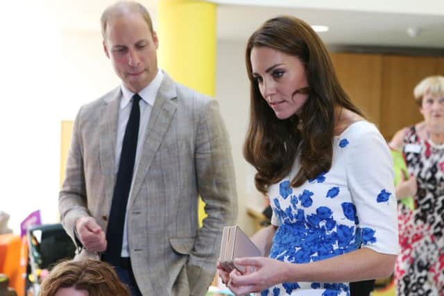 TRH The Duke and Duchess of Cambridge are shown into the Children's Day Support room of Keech Hospice Care. Photo by Danny Loo