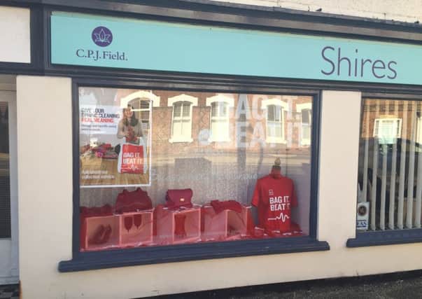 A CPJ Field Shires shop window supporting the British Heart Foundation