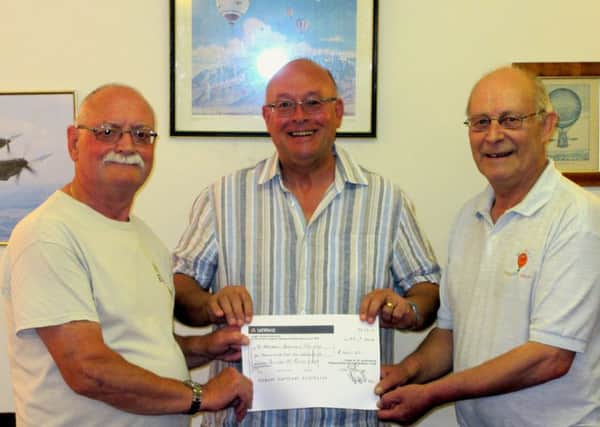 Beecroft Balloon Society receives a generous cheque from Linslade's St Barnbabus  Lodge of Freemasons
