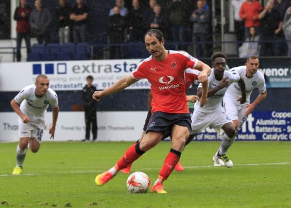 Danny Hylton converts from the spot against Wycombe Wanderers