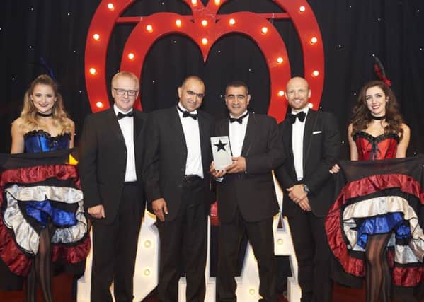 Charles and William Eid (centre) of Dunstable-based Signature Flatbreads receive the 2016 Bakery Manufacturer of the Year award from Matt Dawson (second right)