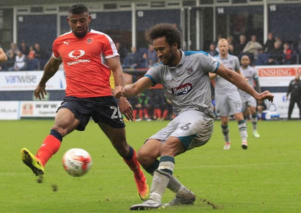 Isaac Vassell challenges Grimsby's Josh Gowling at the weekend