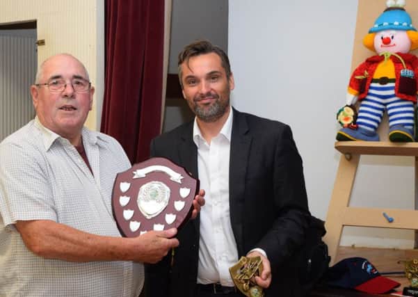 Kensworth annual flower and vegetable show: Bob Iles receives an award from Nick Wearmouth