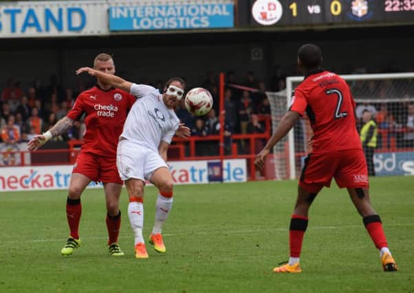 Hatters striker Danny Hylton will continue to wear a mask this weekend
