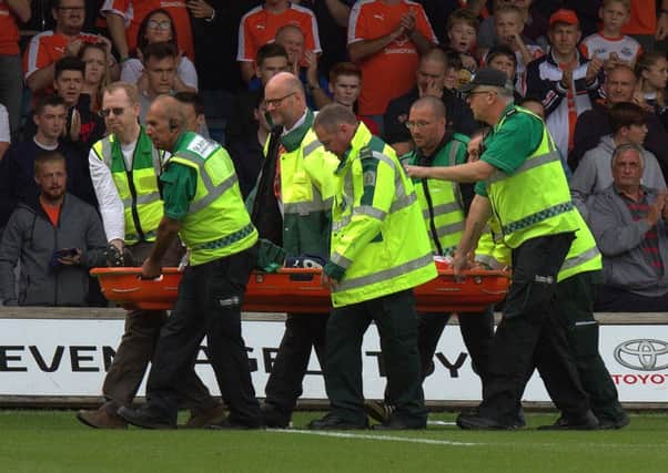 Scott Cuthbert is stretchered off against Doncaster Rovers