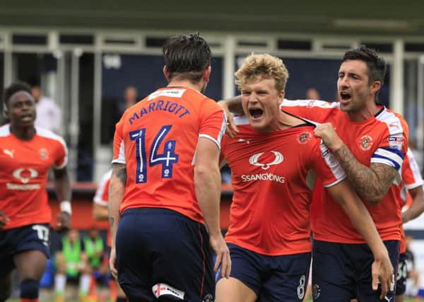 Cameron McGeehan celebrates scoring from the spot against Doncaster