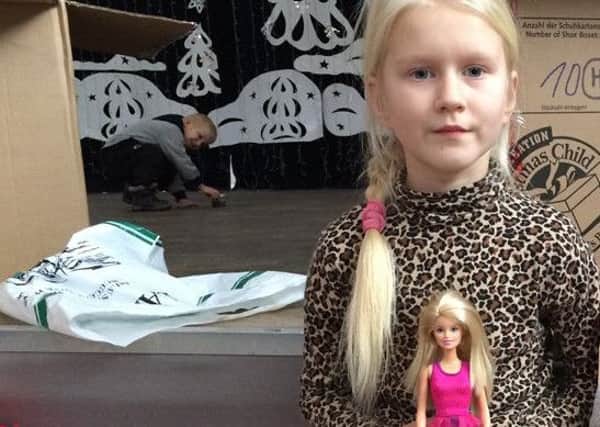 Little Nastya from Belarus with the Barbie doll she received from Operation Christmas Child