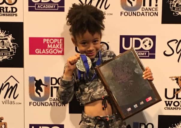 Seven-year-old Taesha Thomas who won second place in the international street dancing championships