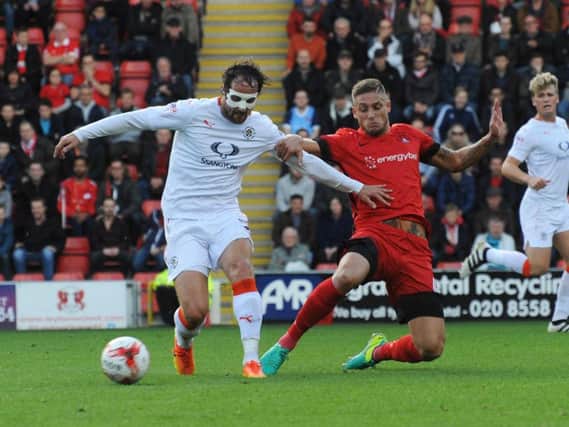 Hatters striker Danny Hylton holds the ball up against Leyton Orient