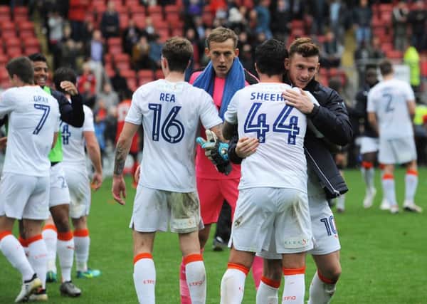 Hatters' players celebrate their 2-1 win at Leyton Orient on Saturday