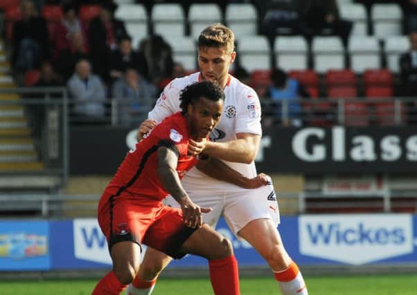 Stephen O'Donnell up against Orient's Sandre Semedo at the weekend
