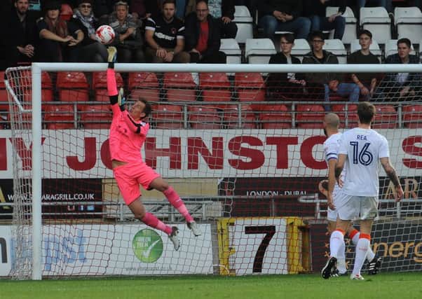 Christian Walton makes a save against Leyton Orient on Saturday
